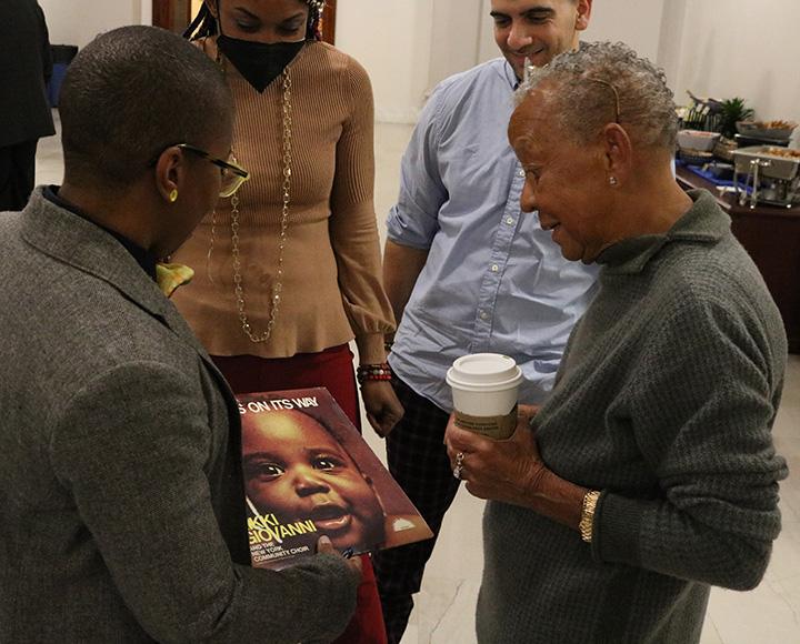 A person shows Giovanni her record, Truth is on its way