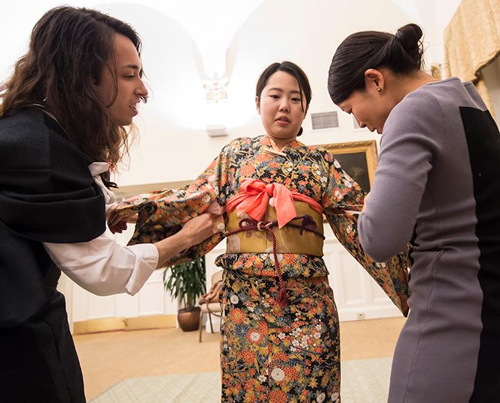 One person each holds a sleeve of a girls kimono
