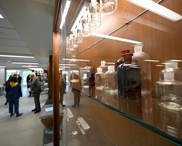 Antique bottles in a glass display case