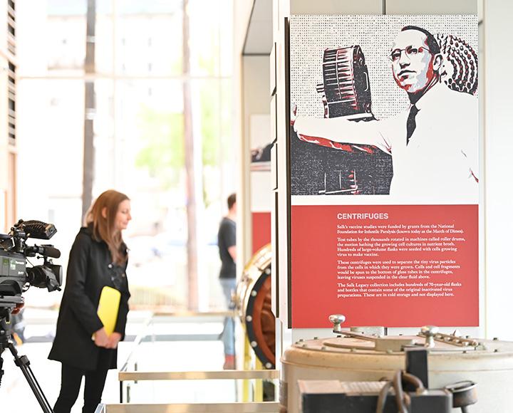 A person looks an exhibit item