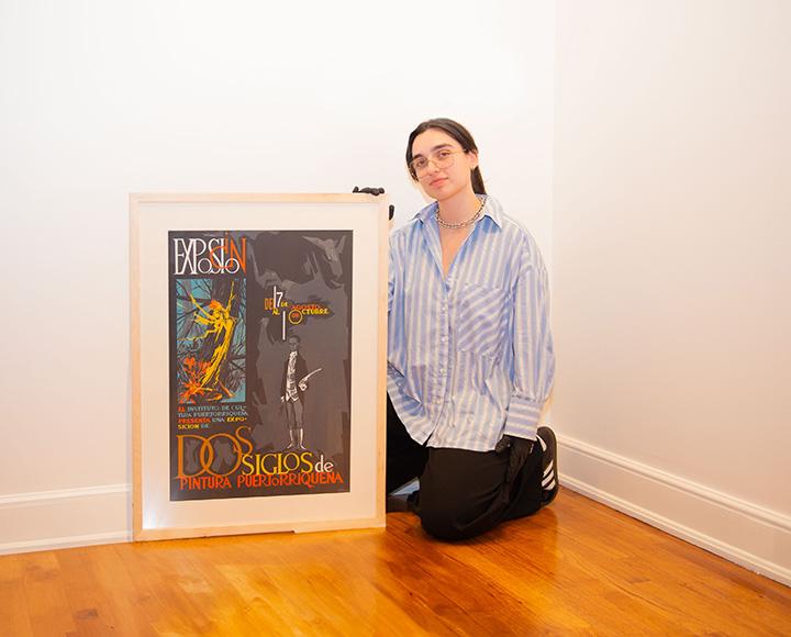 Aguayo with a framed silk screen print