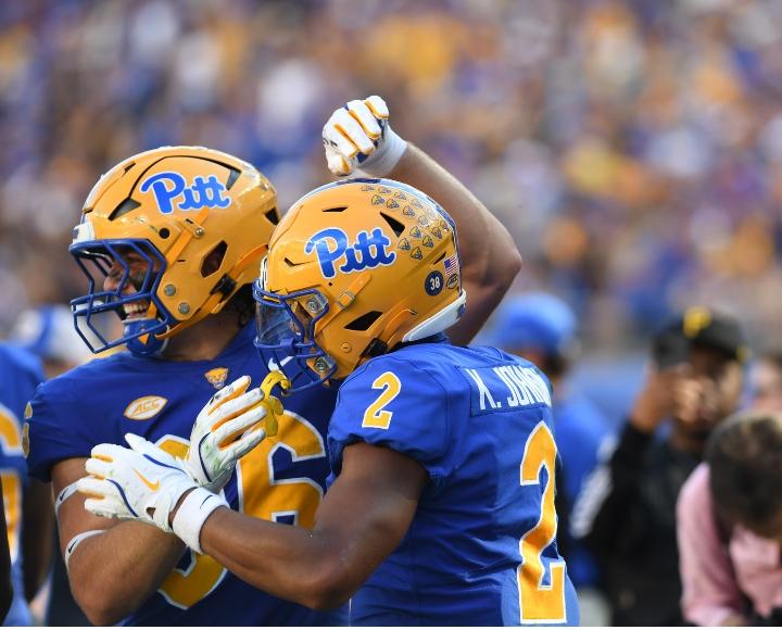 Pitt football players celebrate during the Homecoming game at Acrisure Stadium.