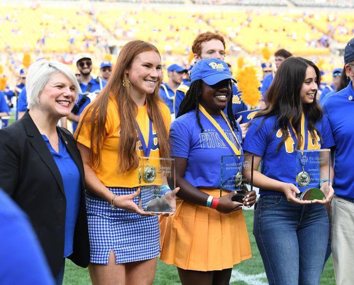 This year’s Spirit of Pitt awardees during halftime of the Homecoming game at Acrisure Stadium.