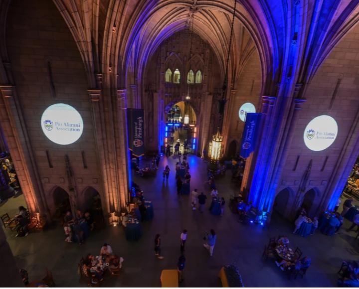 An aerial photo of the Pitt Alumni Association event in the Cathedral Commons Room.