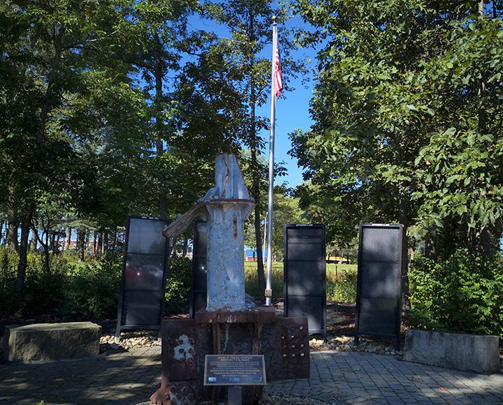The plaque and beam at center of the memorial