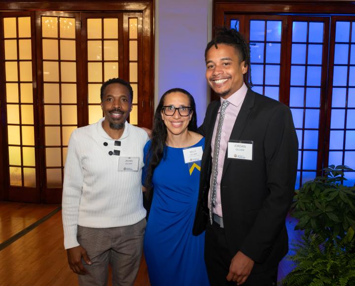 Three people smiling