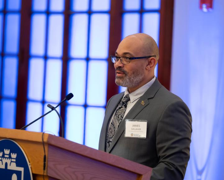 A speaker at a podium