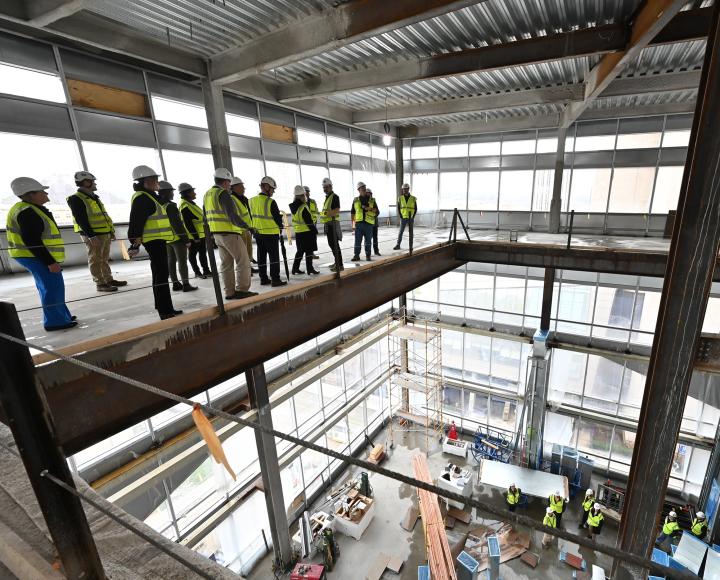 A group tours Pitt’s upcoming Campus Recreation and Wellness Center, which is slated for completion in 2025.