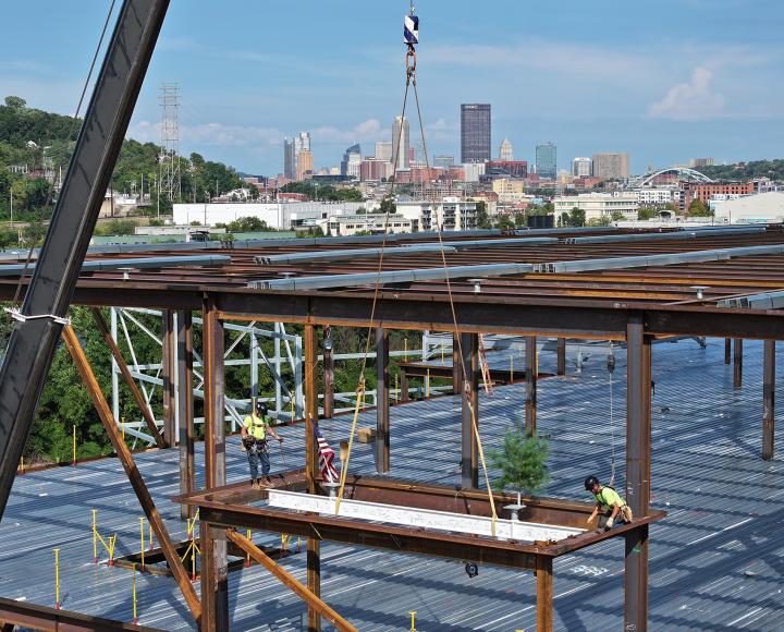 Construction workers progress on the BioForge development.