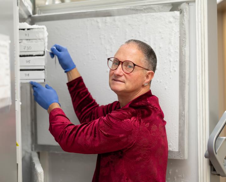 Wagner grabs samples from a freezer