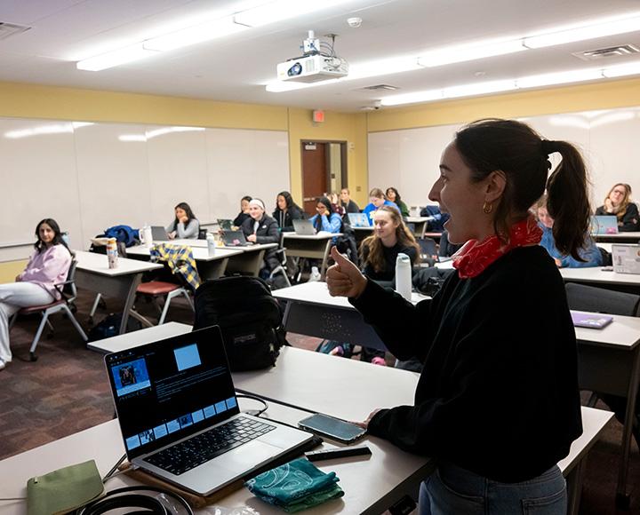 Hirsch gives a thumbs up to students during a lecture.