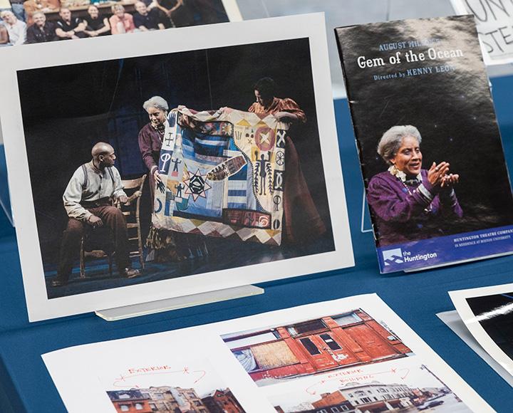 A pamphlet and photo from Gem of the Ocean displayed on a table