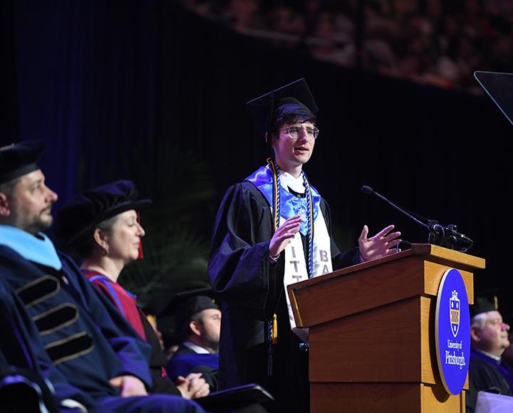 Zachary Shafer speaks in front of graduating crowd