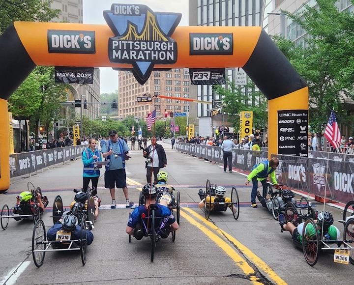 Hand cyclists at the starting line of the Pittsburgh Marathon.