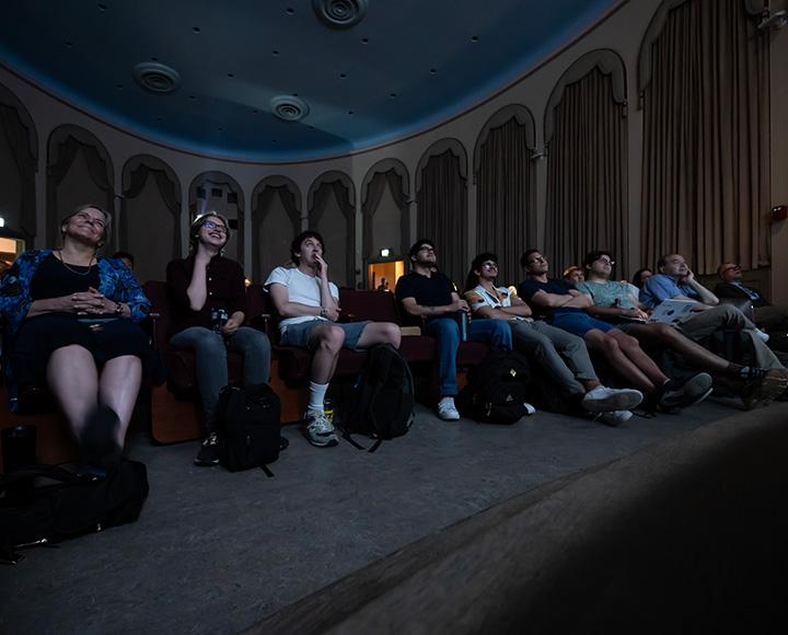 The audience looks up watching a presentation