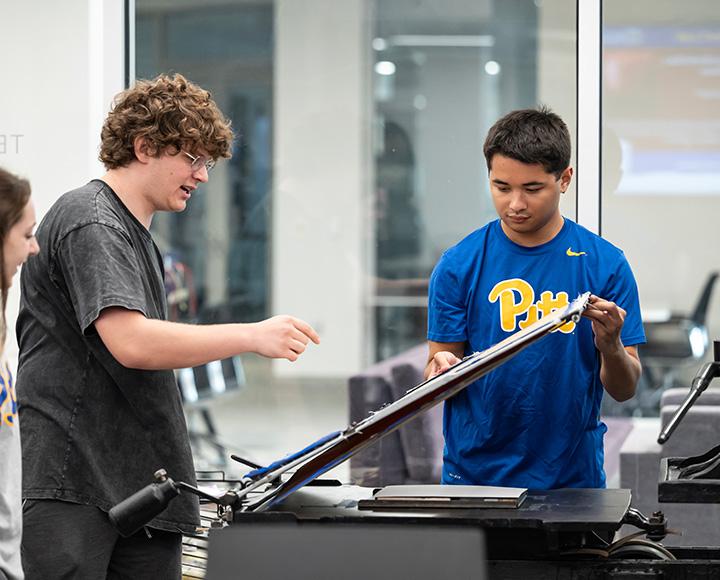 Students interact with a digital exhibit