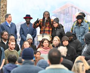 Community and Pitt speakers gather to speak to a crowd at an event at t at Hazelwood Avenue and Lytle Street, where it was announcement about the Hazelwood CEC was made.