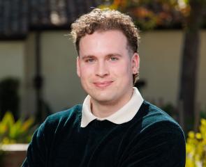 Portrait of Pitt alum Alex Firestine, the University's first Luce scholar.