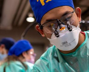 Dental techincian with mask and glasses