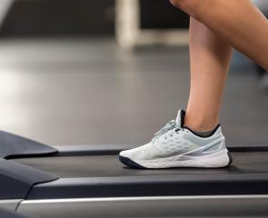 Feet walking on a treadmill