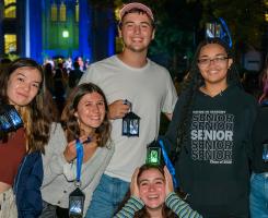 7 students smiling with their lanterns