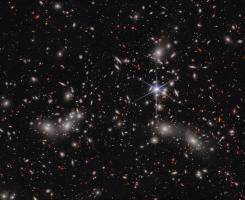 Mulitcolored galaxies against a black sky