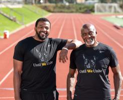 The Webbs stand on a track