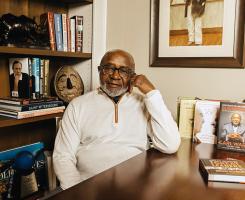 Ware sits at his desk