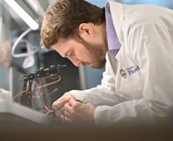 Pitt researcher analyzes wires in a lab.