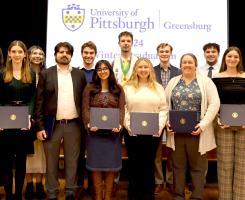Pitt-Greensburg graduates pose for a portrait during the campus' first-ever winter commencement celebration. 