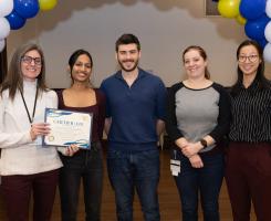CAP participants pose with their certificate of achievement.