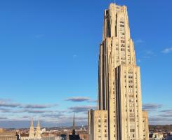 The Cathedral of Learning against a blue sky