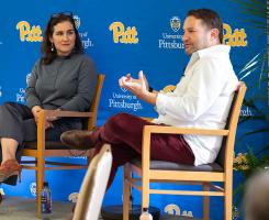 David Greene and Katie Dealy speaking to an audience