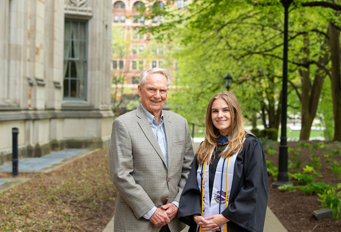 Zurcher and Davis, who wears graduation robes and cords
