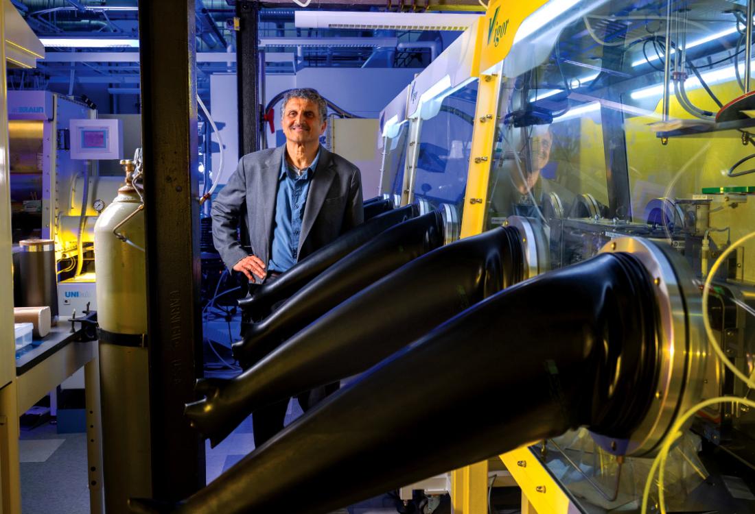 A man poses for a photo in a research facility.