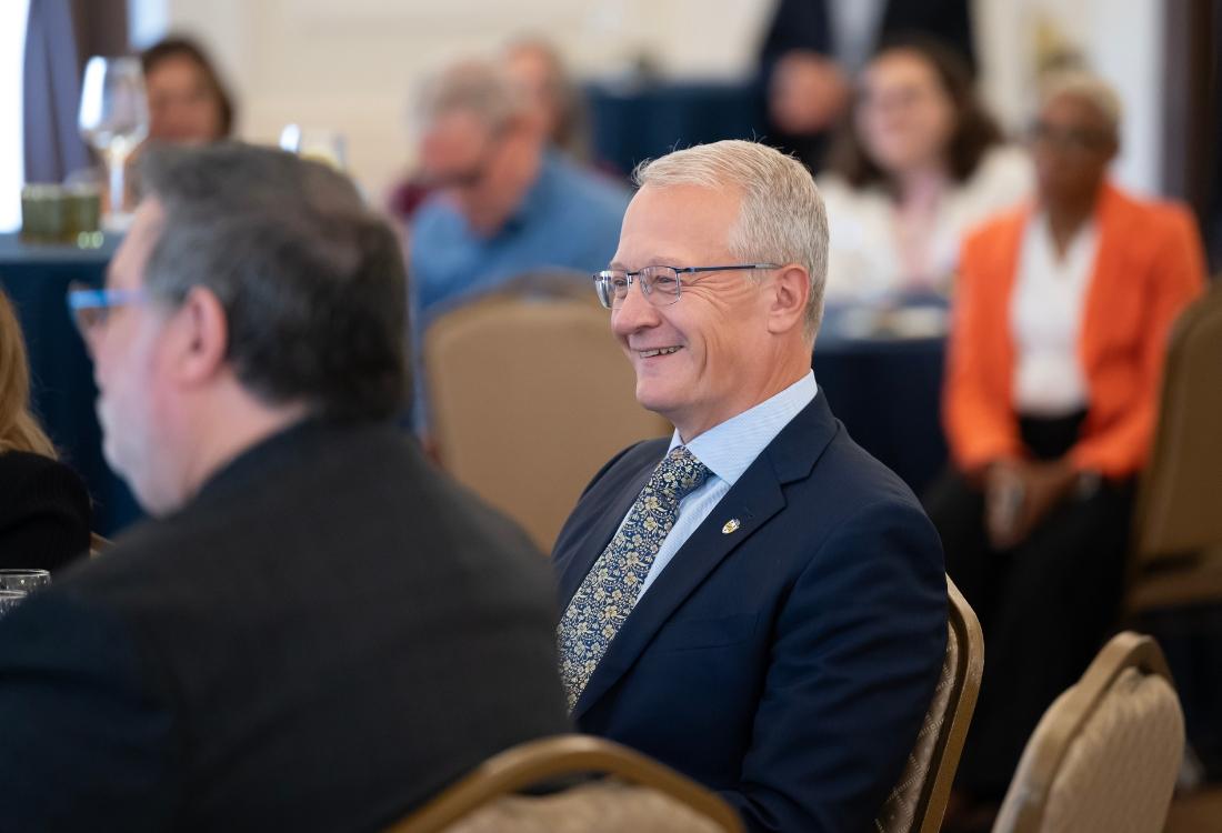 Dave DeJong smiles during a Pitt Board of Trustees meeting in 2024.