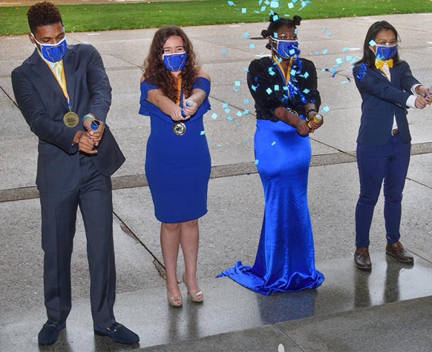 Homecoming court with confetti poppers