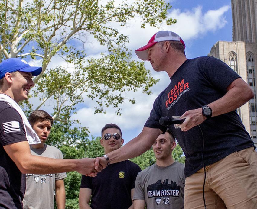 two men shaking hands outside of the Cathedral
