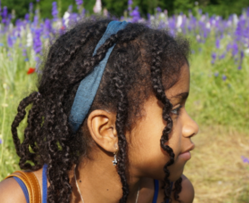 Girl in a field of purple flowers
