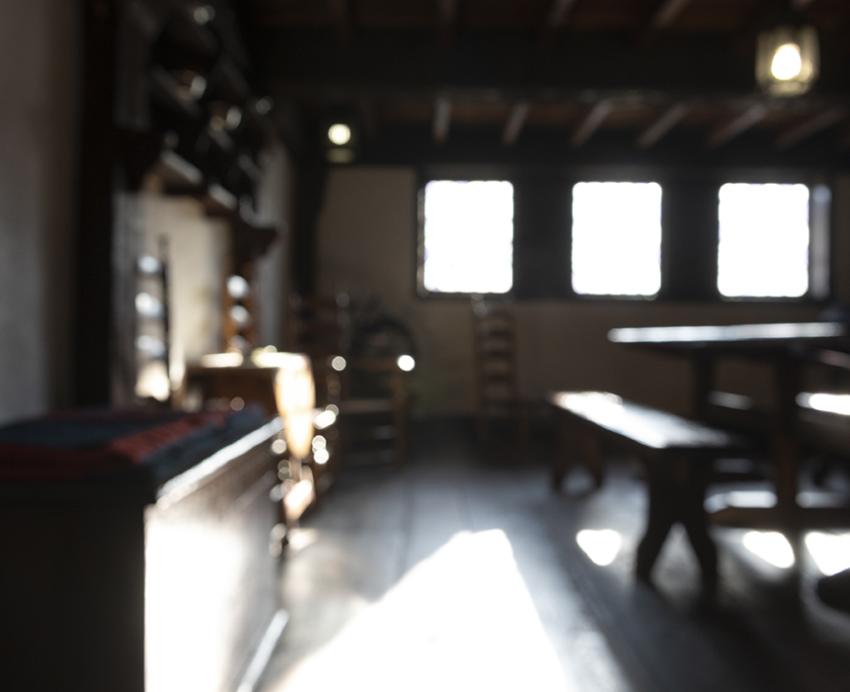 Dark room with wooden floors and furniture 
