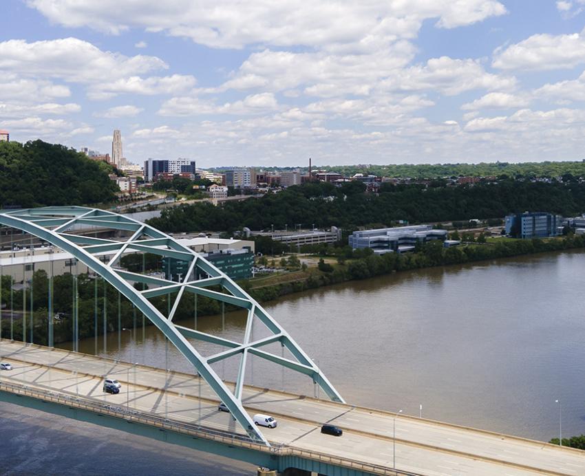 Blue bridge over a river in Pittsburgh