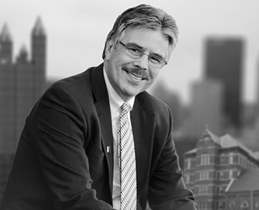 Ken Gormley with Pittsburgh buildings in background