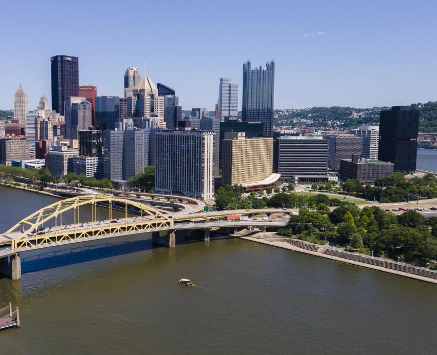 Pittsburgh skyline in the daytime with view of yellow bridges and rivers