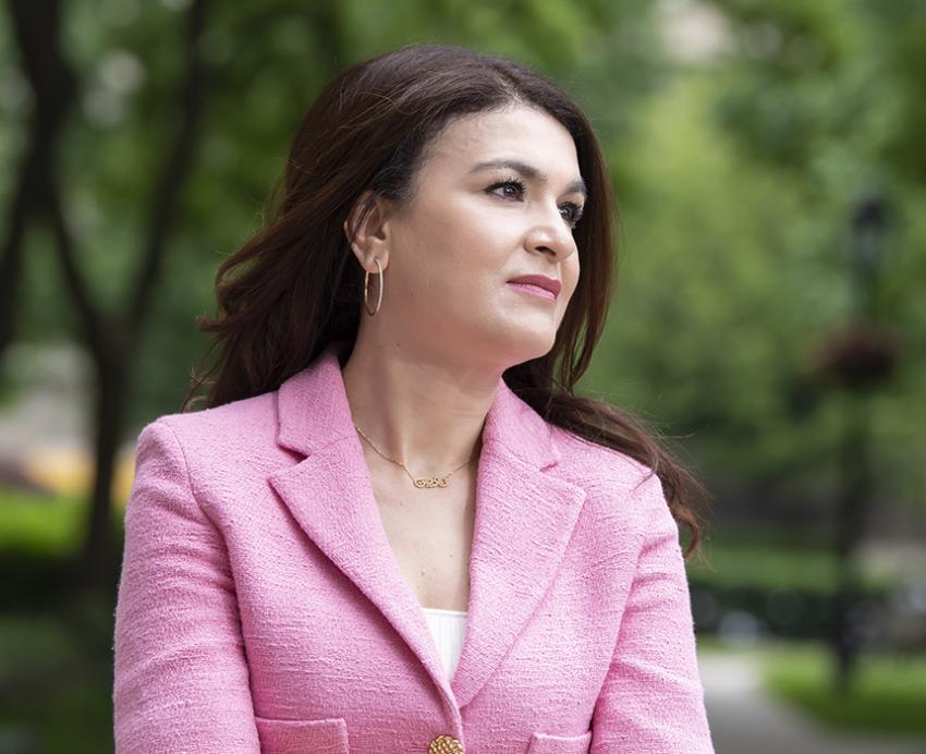 Nadine Melhem standing outside with pink jacket