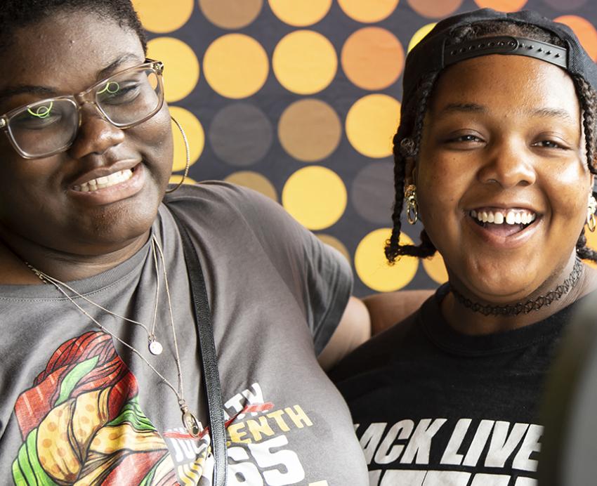 Two people smiling and celebrating Juneteenth