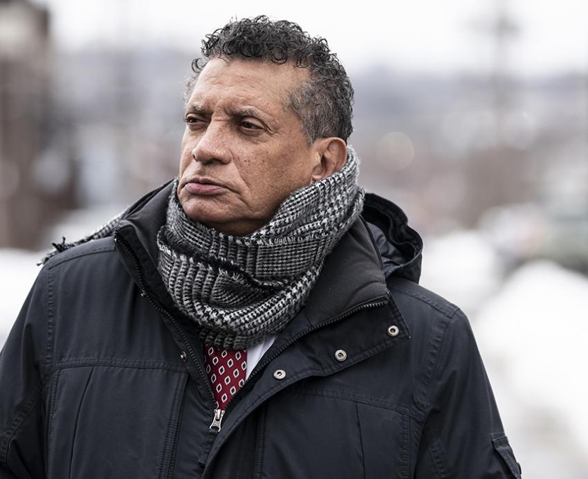 Tim Stevens standing outside wearing black coat during winter