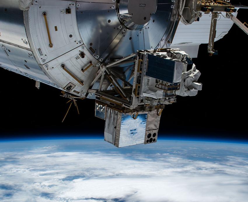 Space station floating in space above Earth