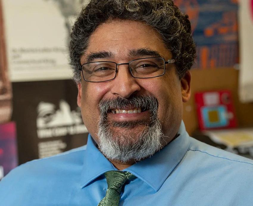 Geoffrey Glover in a blue shirt and green tie