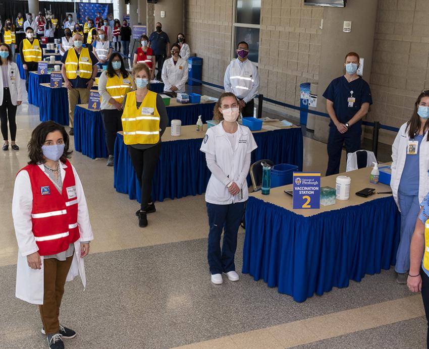 Vaccine Clinic volunteers all looking at camera