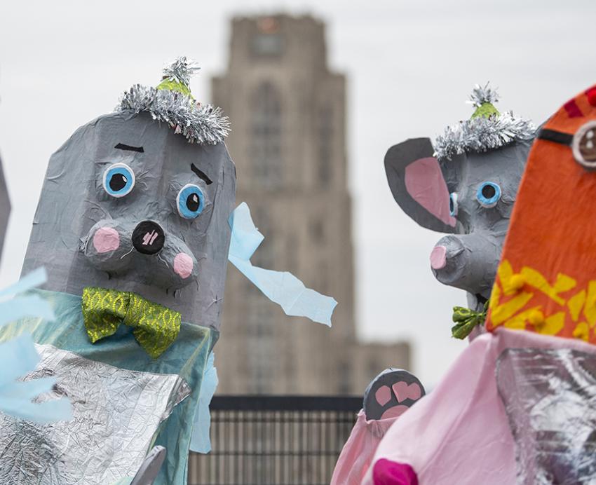 Middle schoolers dancing in giant puppet costumes in Oakland